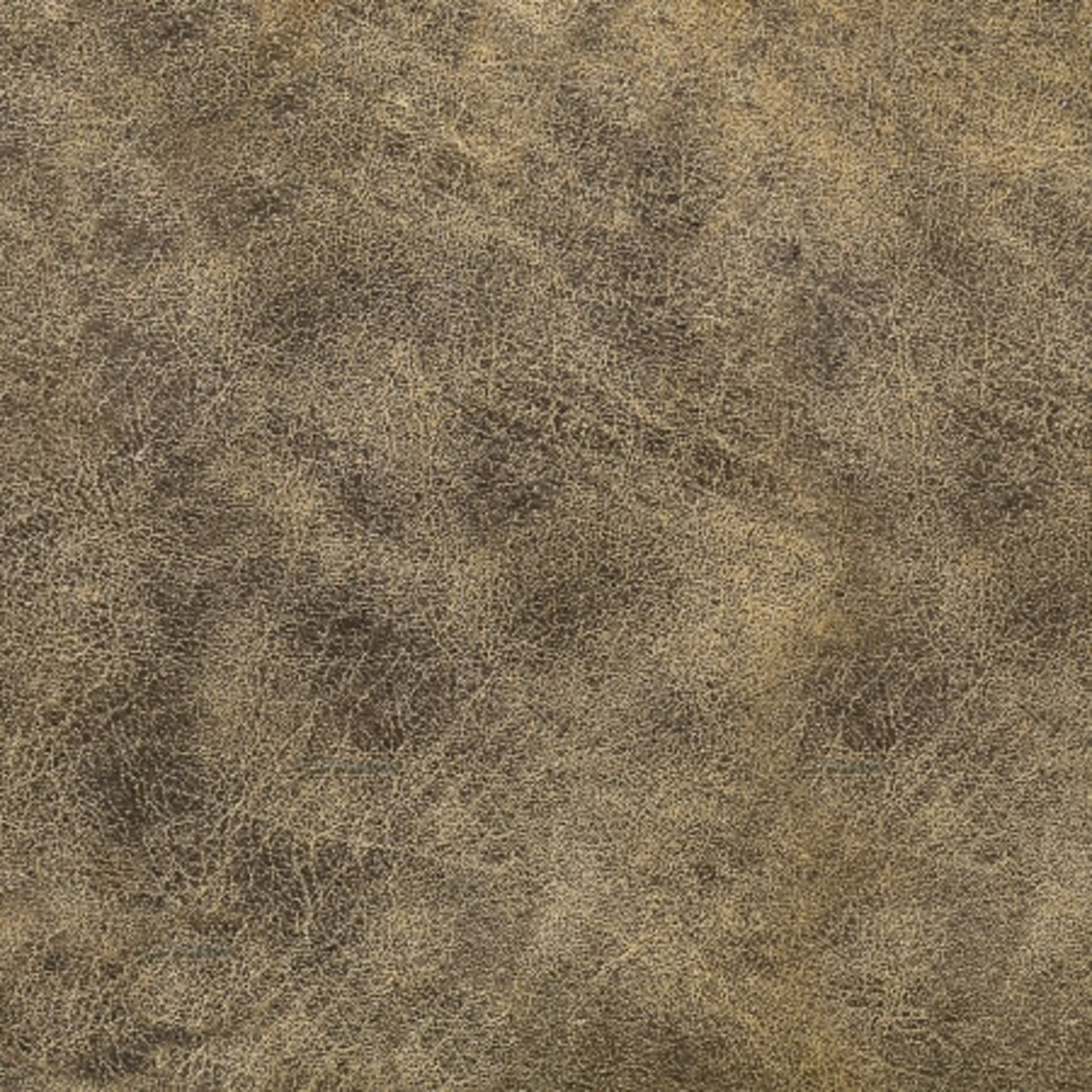 Detailný pohľad na eko kožu v zemitej farbe.