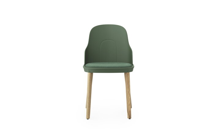 Detail zelenej jedálenskej stoličky s čalúneným sedákom a dubovými nohami