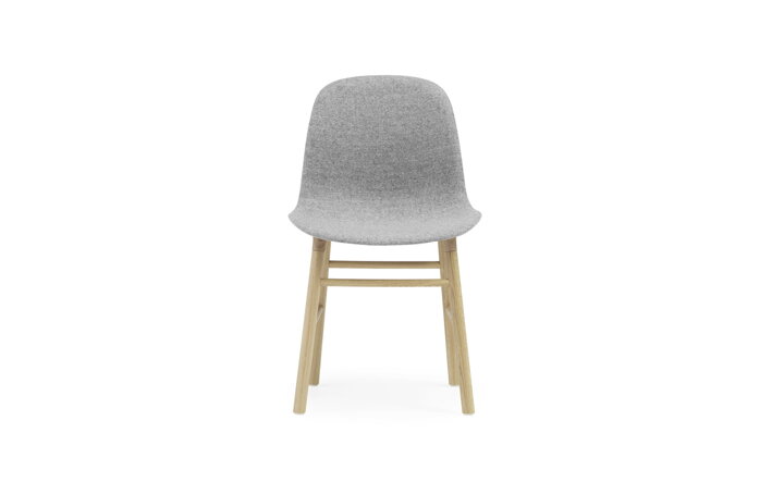 Čalúnená jedálenská stolička sivej farby s dubovými nohami