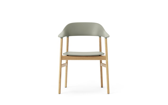 Detail prednej strany zelenej stoličky s podrúčkami