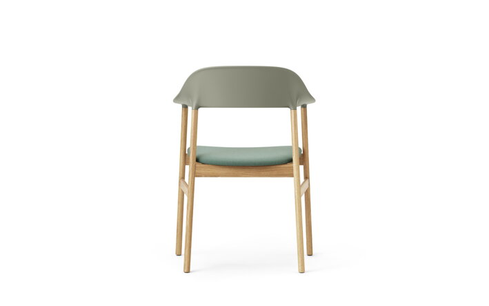 Detail zadnej strany zelenej stoličky s podrúčkami