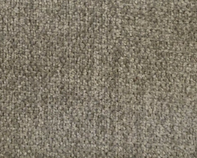Vzorka tkaniny Brushed v teplej sivej farbe.