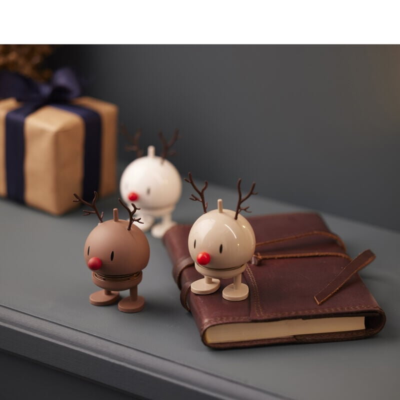 Veselé figúrky Hoptimisti položený na diári.