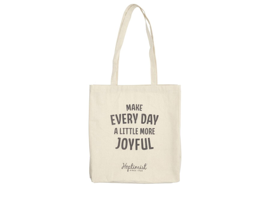 Originálny nápis "Make every day a little more joyfull" v preklade "Urobte si každý deň o niečo radostnejší", na jednej strane bavlnenej nákupnej tašky