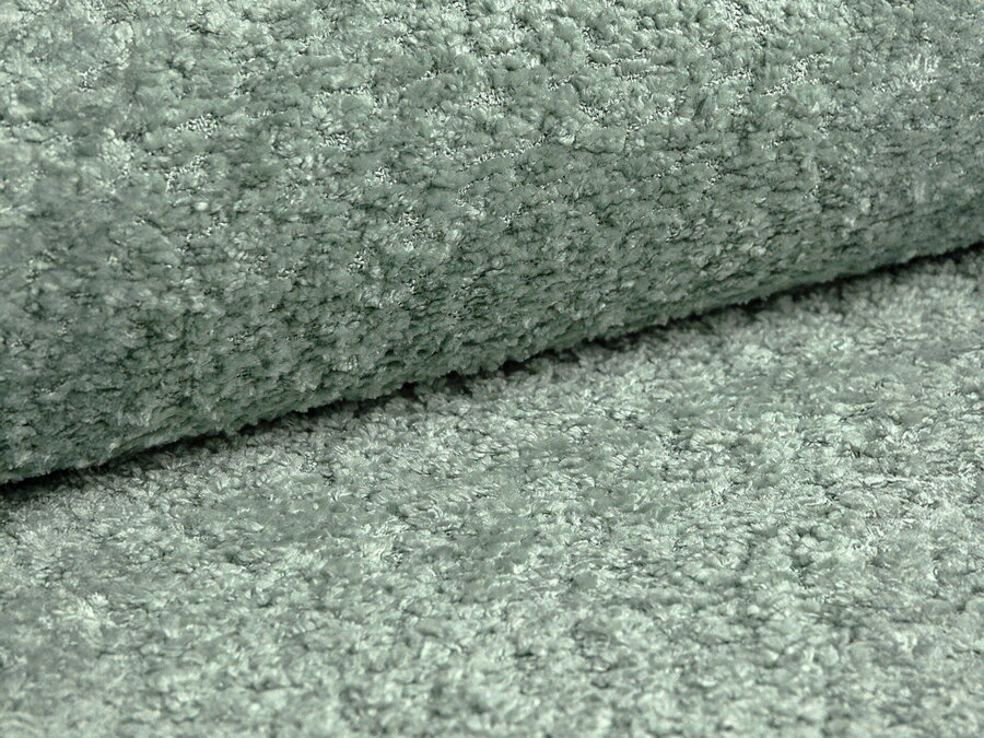 Vzorka tkaniny Boucle (Coral) vo svetlej pepermintovej farbe.