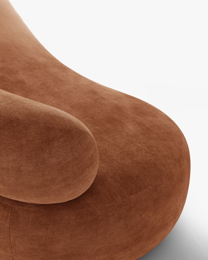 Detail na ženilkové čalúnenie v terakotovej farbe.