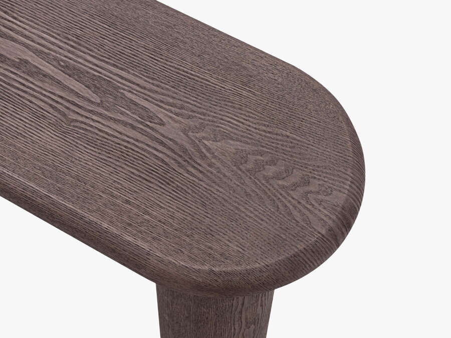 Detail na zaoblenú stolovú dosku tmavohnedého konzolového stolíka.