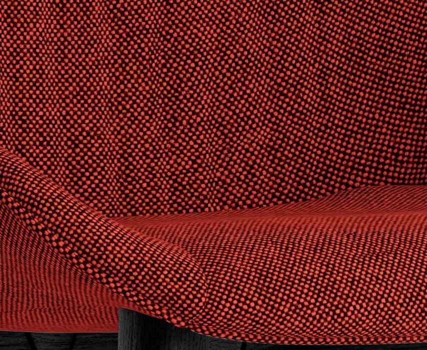 Detail na červený čalúnený sedák stoličky Hyg Comfort s čiernymi dubovými nohami