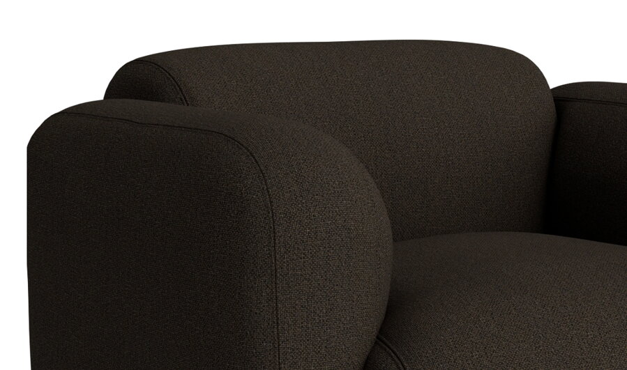 Detailný pohľad na tmavohnedé kreslo Swell Armchair a jeho čalúnenie.